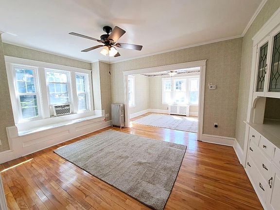 dining room with window seat and china cabinet storage