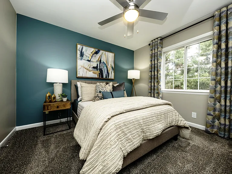 Cozy bedroom suite with ceiling fan