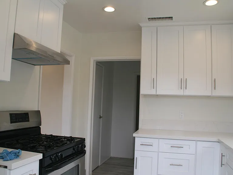 Kitchen looking into pantry
