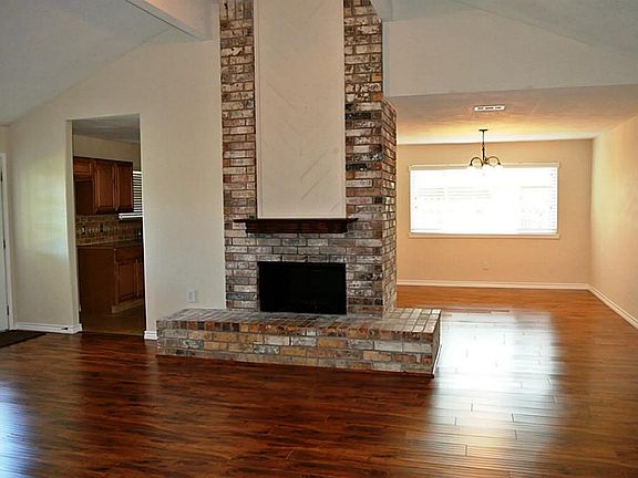 View of the formal dining room and brick accent fireplace
