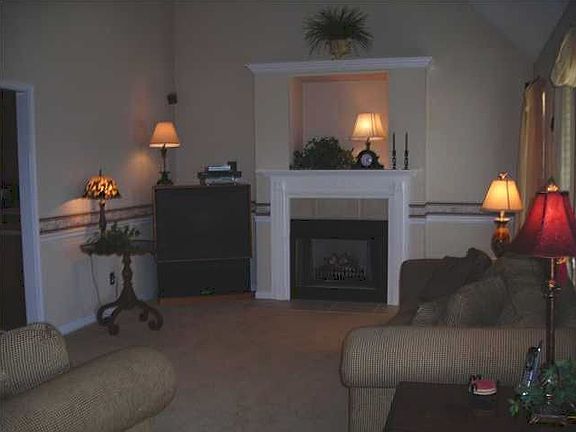 The great room is spacious and has a gas log fireplace.