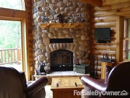 Great Room
						:
						Floor to ceiling stoned wood burning fireplace