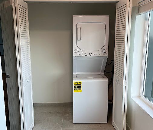 Closet #2 has new washer-dryer and lots of space for other items.