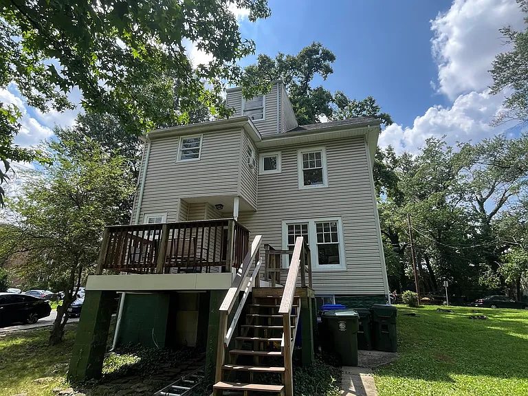 back of house with big yard