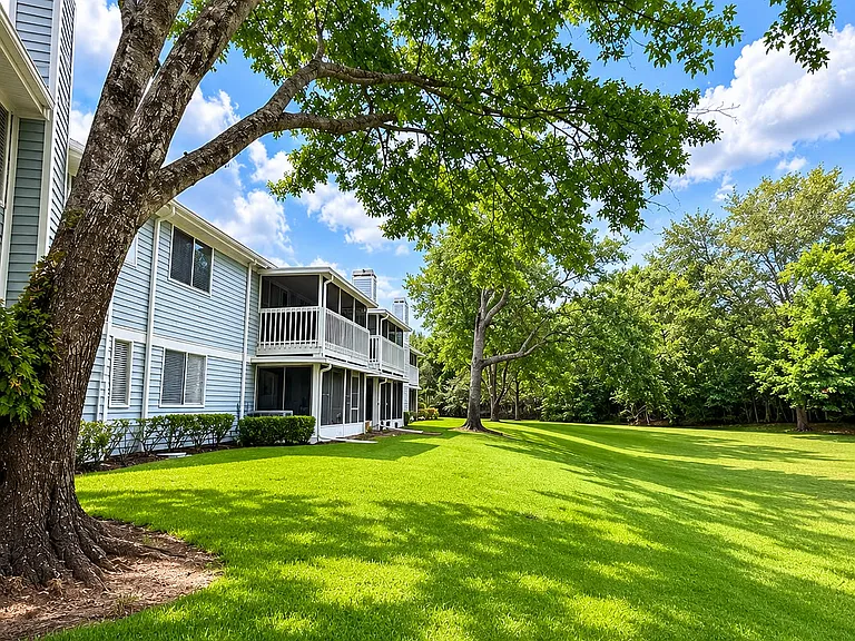 Peaceful open green space views with no rear neighbors directly behind the unit.