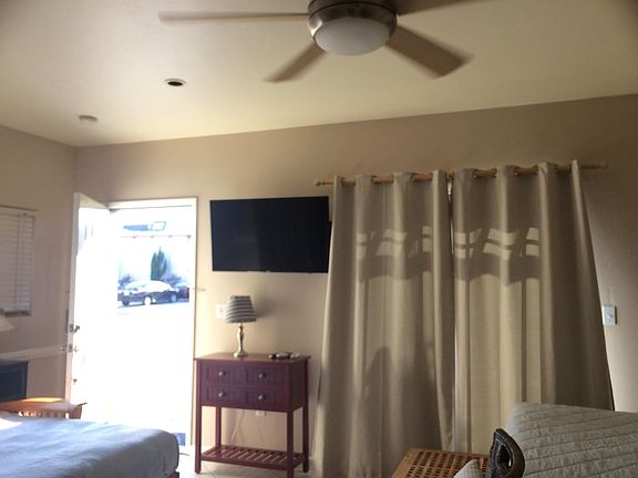 Partially shown with the futon pulled out and made into a comfortable memory foam mattress for your out of town guests, linens provided