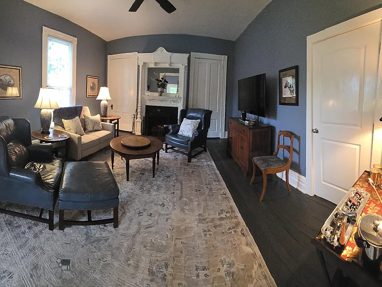 Panoramic view from living room entrance; pocket door can be closed for privacy between Keeping room/dinning room and Living Room if converted to a bedroom. Bourbon bar set up to the right.