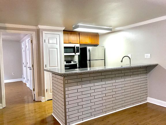 Kitchen solid wood cabinets with granite countertops.