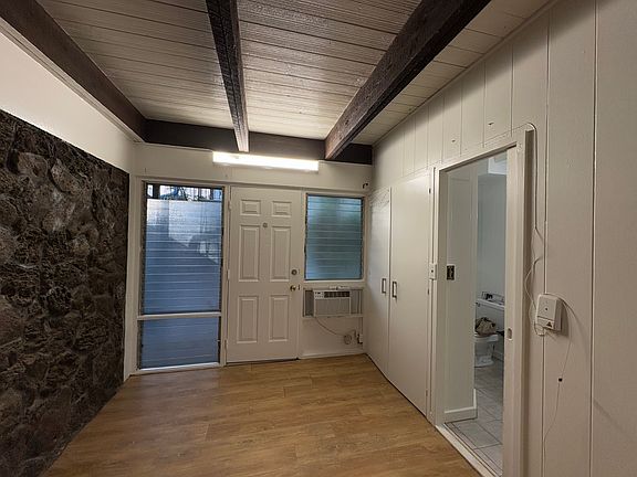 Front Entrance, solid rock accent wall without furniture