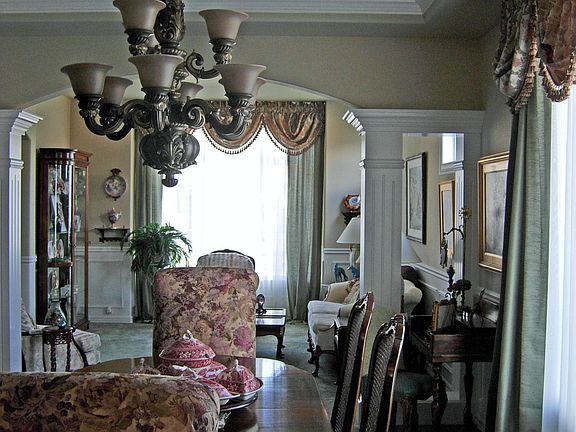 Formal Dining with Coved Ceiling and Medallions