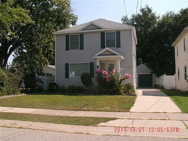 House from street.  Beautiful landscaping!