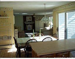 large eat in kitchen with french door slider to outdoors