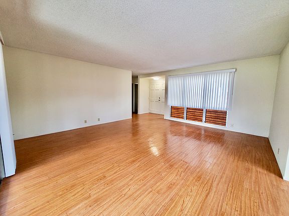 Spacious Living Room with Fresh Paint and New Blinds