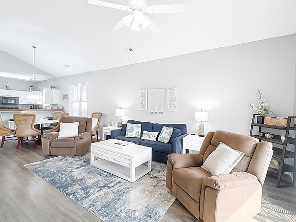 Spacious living room with comfortable seating and open floor plan. Plenty of natural light.