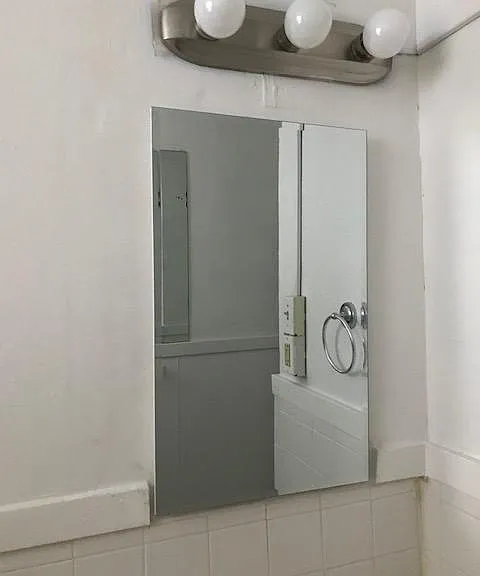 Bathroom with new medicine cabinet and other fixtures
