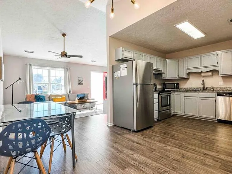 Open concept living room, dining area, kitchen.