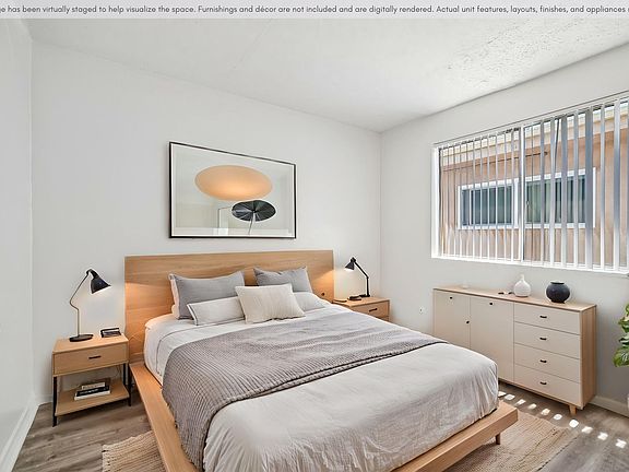 Spacious bedroom with a bright, comfortable layout and natural light.