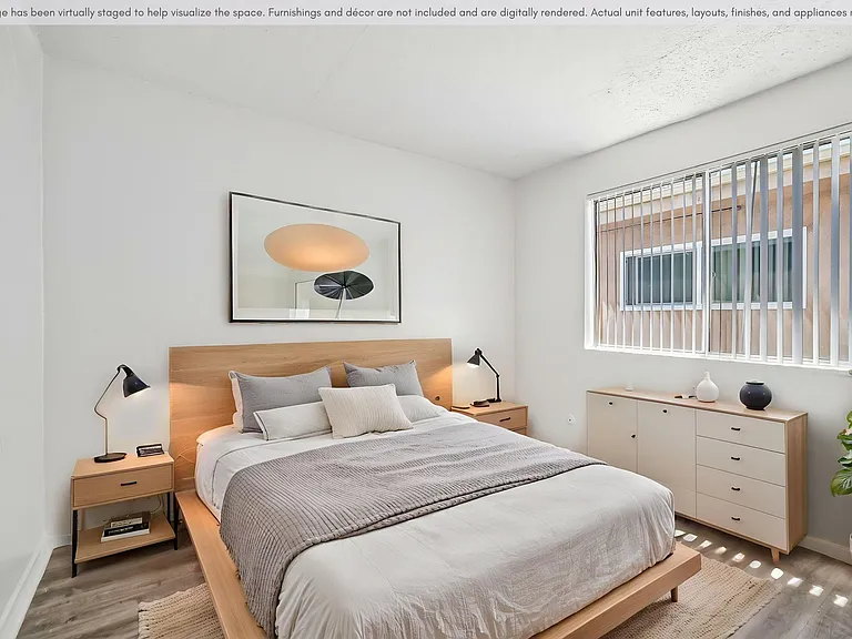 Spacious bedroom with a bright, comfortable layout and natural light.