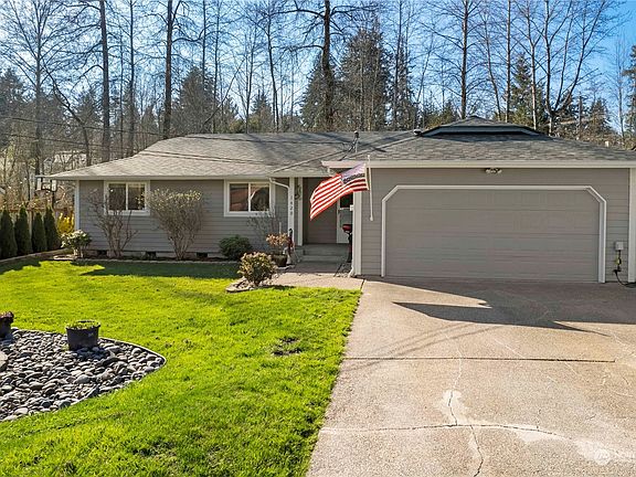 Outside, the home boasts a new roof, skylights, and a freshly painted exterior. A 2 car garage adds convenience.>