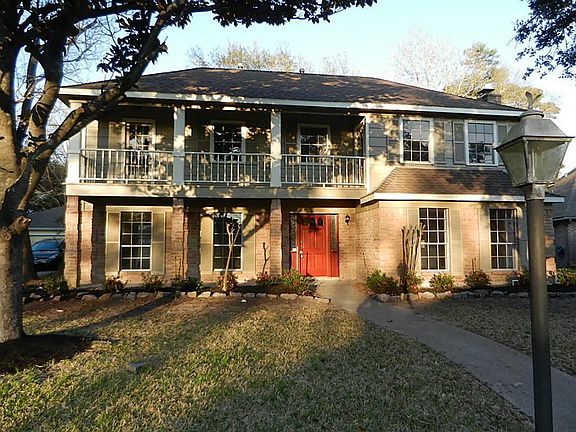 mature trees accent the front yard