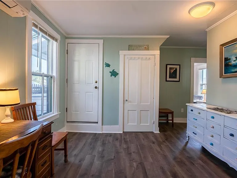 A different view of the bonus room with writing desk and sto