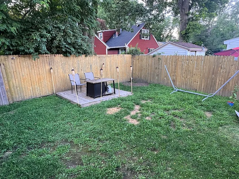 Large backyard - private and fully fenced in. We'll be adding some new plants! :)