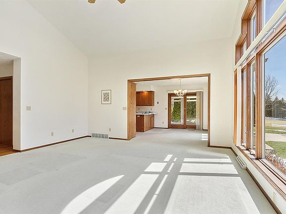 Living room leads to kitchen/dining area