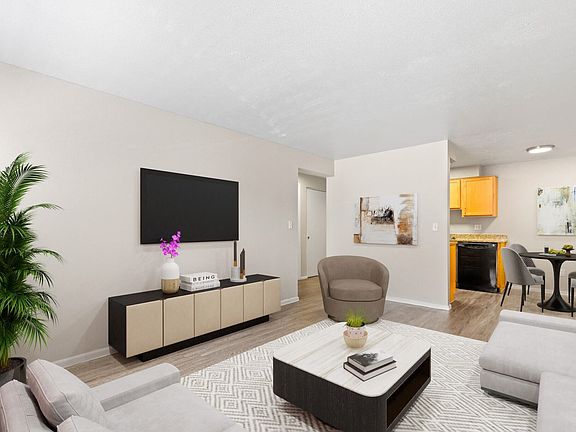 Comfortable layout with neutral tones and sleek media setup