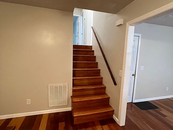 Stairway to bedrooms and bathroom