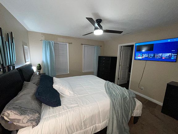Master bedroom with Cal King bed and walk-in closet
