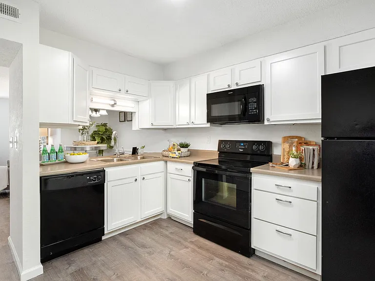 New cabinets and matching black appliances. All units now have Granite counters.