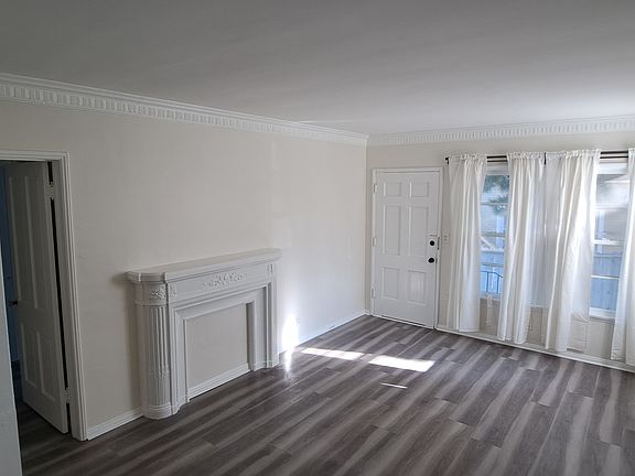 living room with faux Fireplace 18'x12' square feet