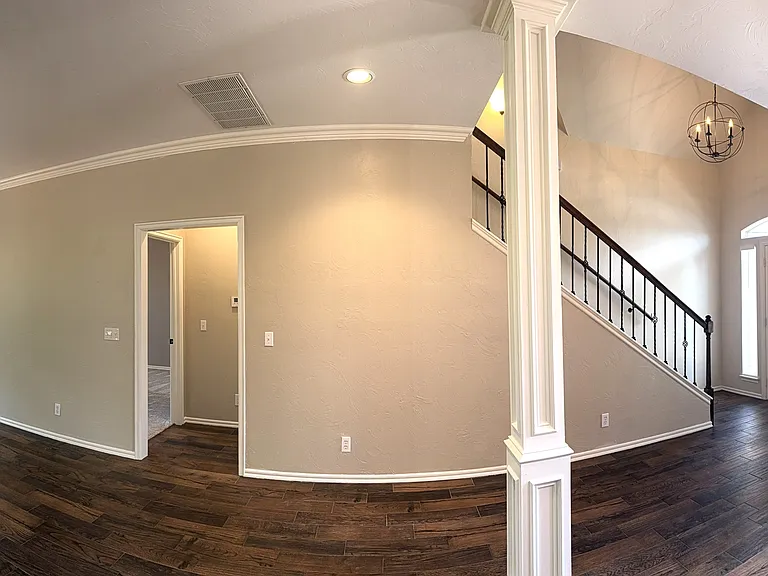 Panoramic dining room to living room.