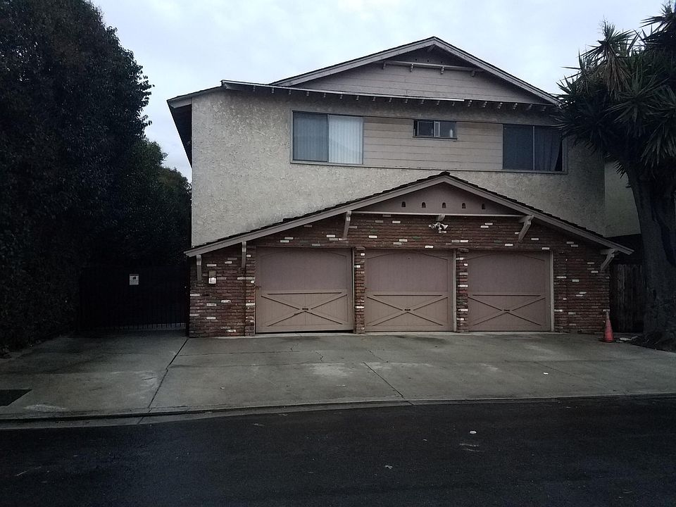 Front of building. Center garage and driveway space are for this unit.