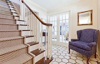 Welcoming foyer. Living room through the glass doors on right, and the family room is on the left.