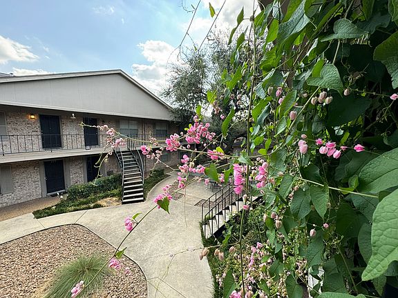 Peaceful greenery and floral accents.