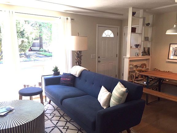 living room, dining area, front entry, open shelves, big windows
