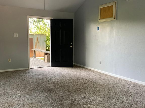 Vaulted living area opens to kitchen