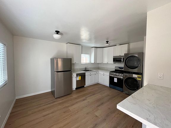 View of Kitchen from living room with eat at counter