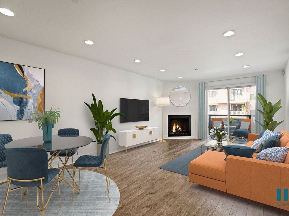 Dining and Living Room with Electric Fireplace and Patio