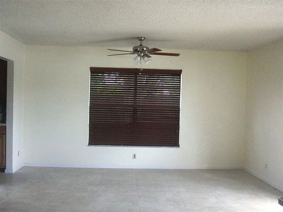 Dining Area with new cherry blinds and new fan.