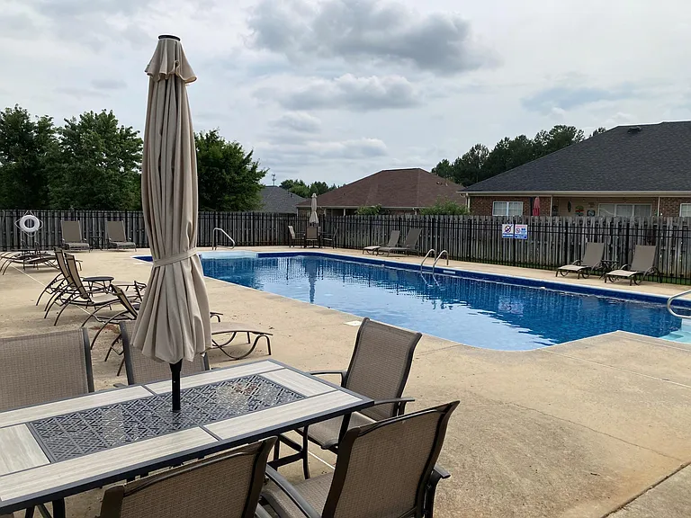 Pool with chairs and umbrellas for hot summer days! Short walk from house.