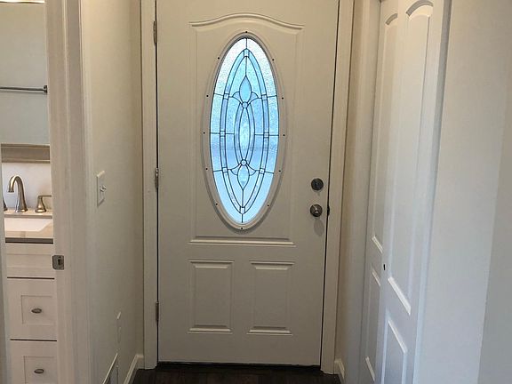 Front door & half bath.