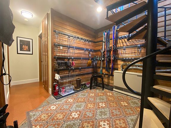 1st floor has mudroom entry area with gear storage system, 2 bedrooms with cork flooring, and 1 bathroom with tub, washer/dryer and tile flooring.