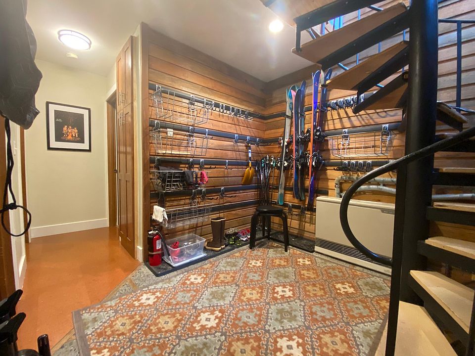 1st floor has mudroom entry area with gear storage system, 2 bedrooms with cork flooring, and 1 bathroom with tub, washer/dryer and tile flooring.
