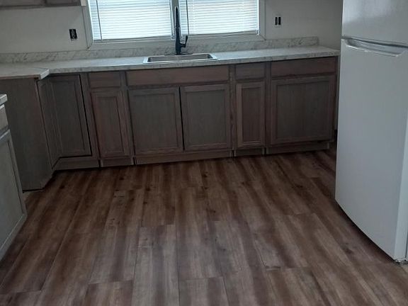 New flooring, new cabinets, new faucet, new refrigerator.