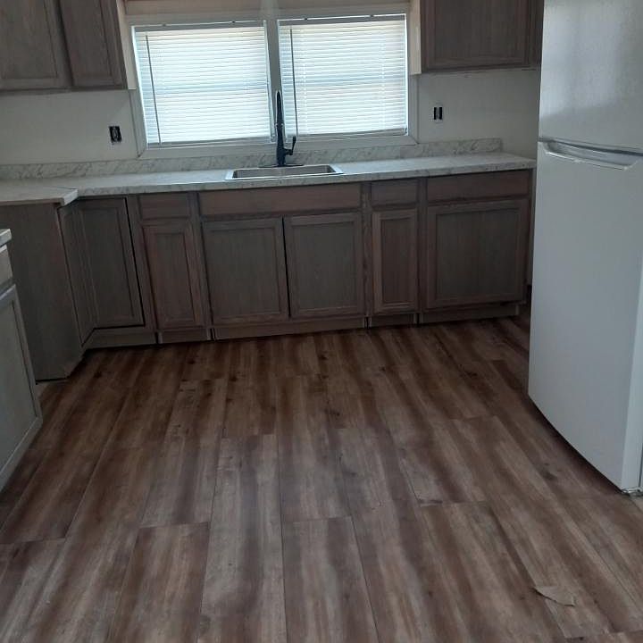 New flooring, new cabinets, new faucet, new refrigerator.