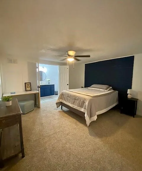 The main bedroom is in a private space with a queen bed and has its own bathroo for convenience.