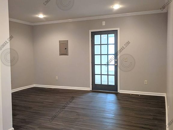 Main entrance flows into the dining room, kitchen, and first full bath.