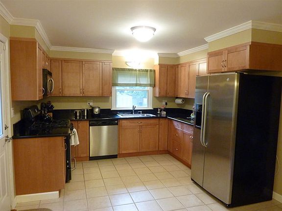 Remodeled Kitchen with Maple Cabinets, Stainless Appliances and Tile Floor